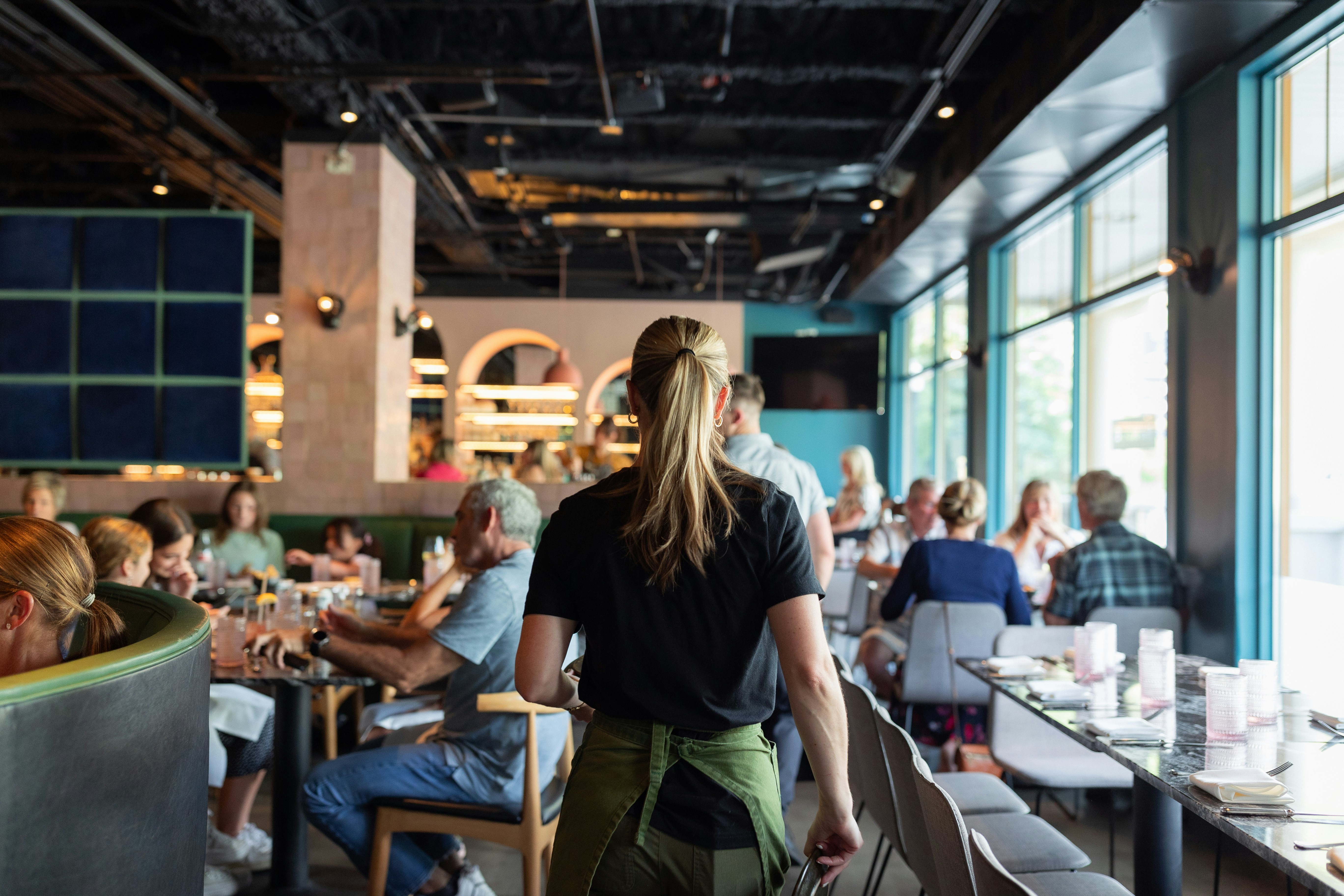 Busy restaurant front of house — never miss a call